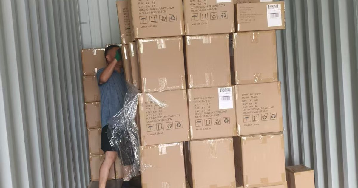 Cartons stacked and labelled inside a container during loading in China